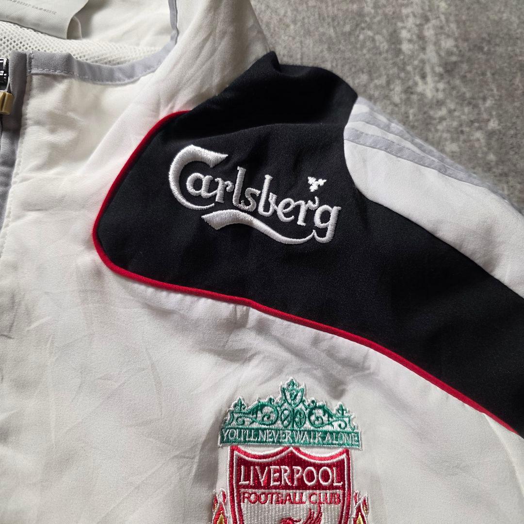 adidasアディダスリヴァプールナイロンジャケットドローコード刺繍ロゴサッカー