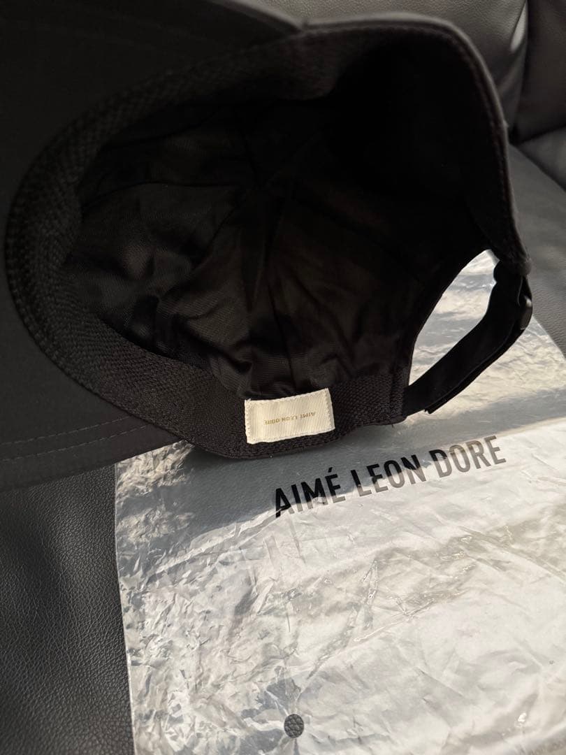 AIMÉ LEON DORE WATERPROOF SHELL CAP