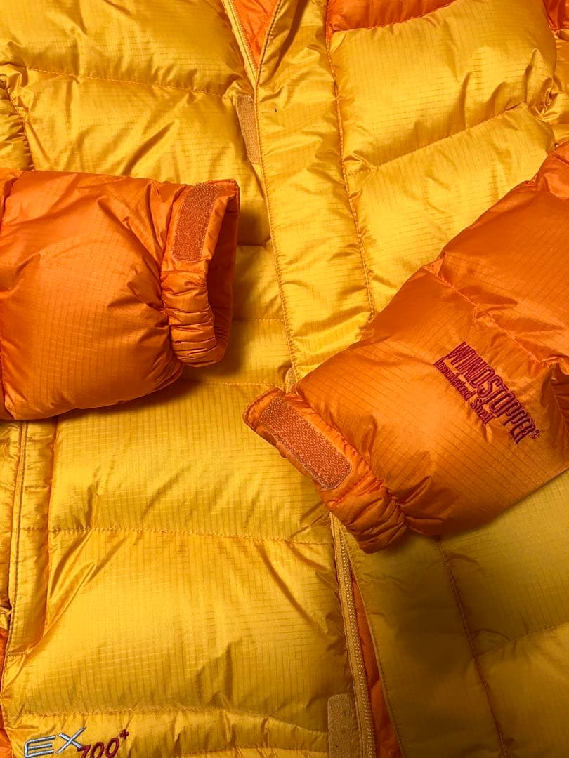 mont-bell フード付きダウンジャケット オレンジ/イエロー