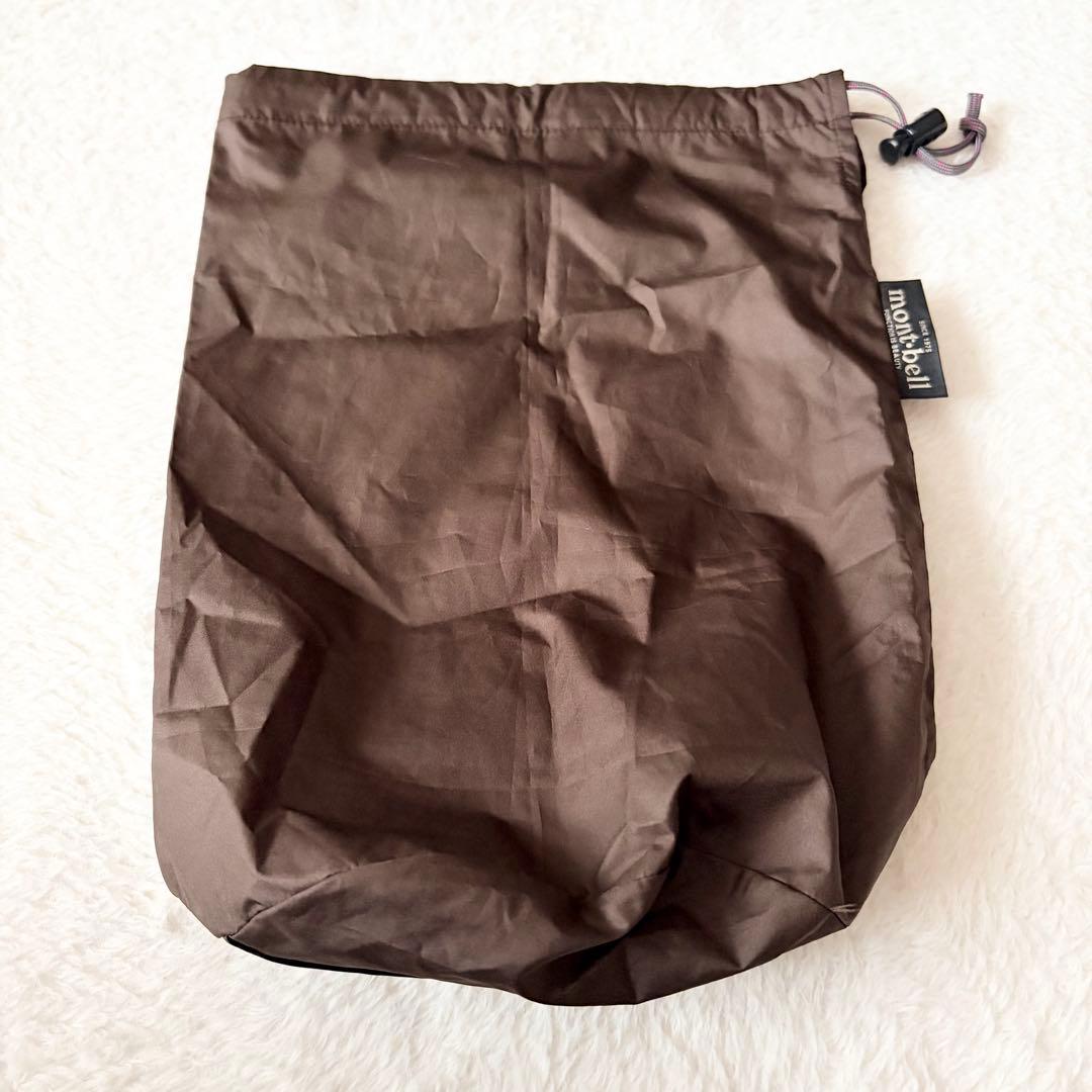 5552 美品✨ モンベル トラベルダウンロングコート L ブラウン 収納袋付き