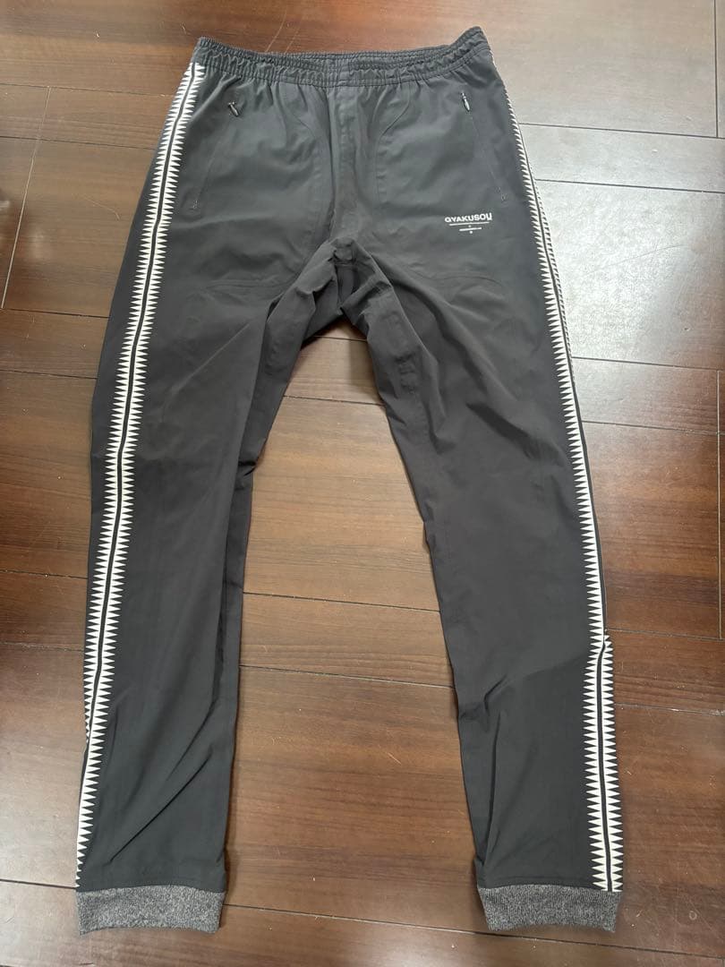 NIKE × UNDERCOVER GYAKUSOU GIZ柄 トラックパンツ