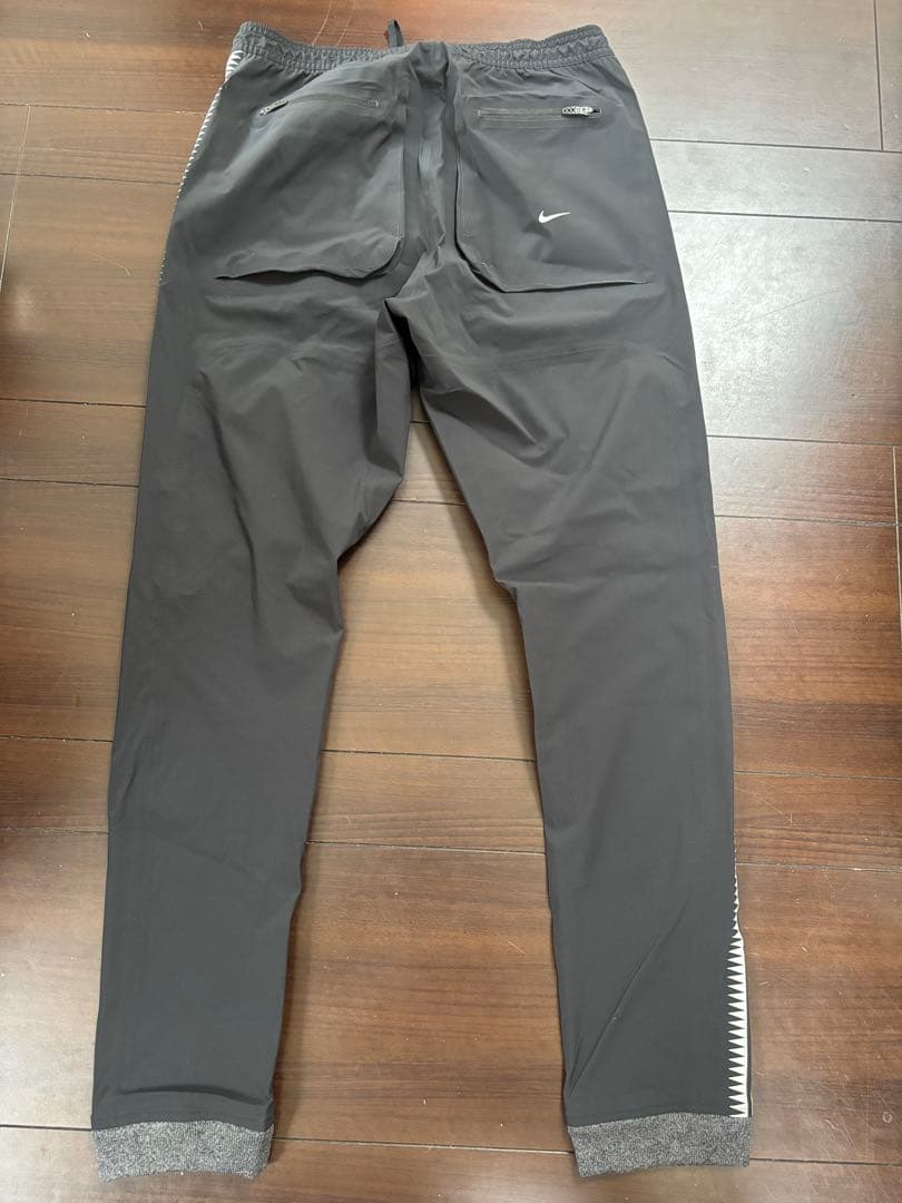NIKE × UNDERCOVER GYAKUSOU GIZ柄 トラックパンツ
