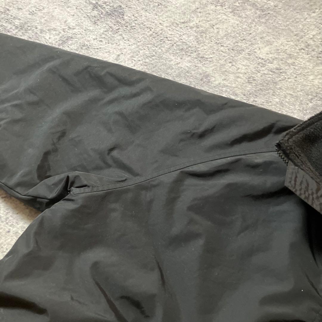 00sTRIMOUNTAIN企業ロゴウォームアップジャケットナイロンブラック黒M