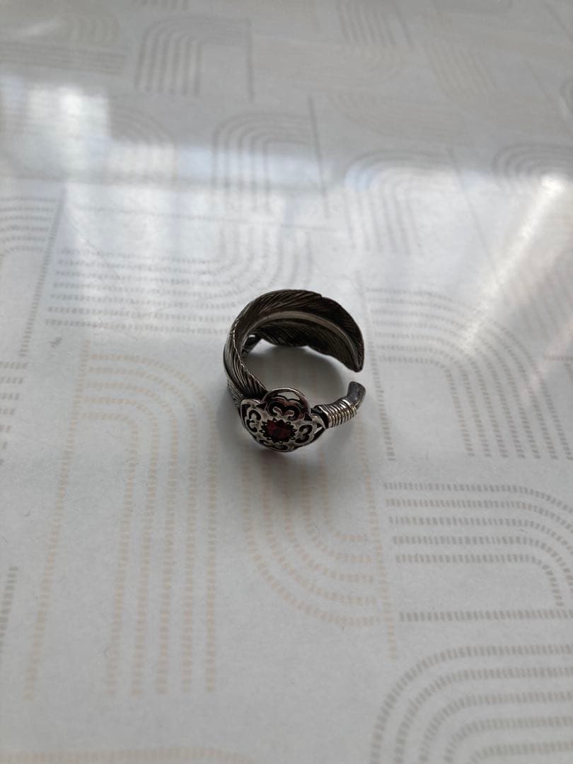 DESIGNERS JEWELRY buff フェザーリング エンブレム付