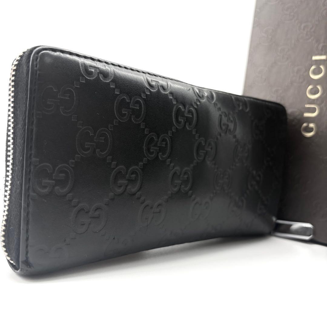 GUCCI　長財布　シマ　レザー　黒　ラウンドファスナー　GG柄　エンボス