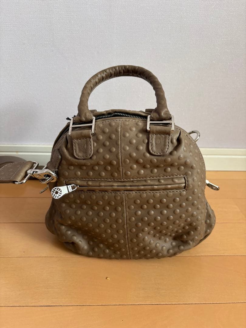 muta x garuglier エンボス8バッグ・カーフ 革