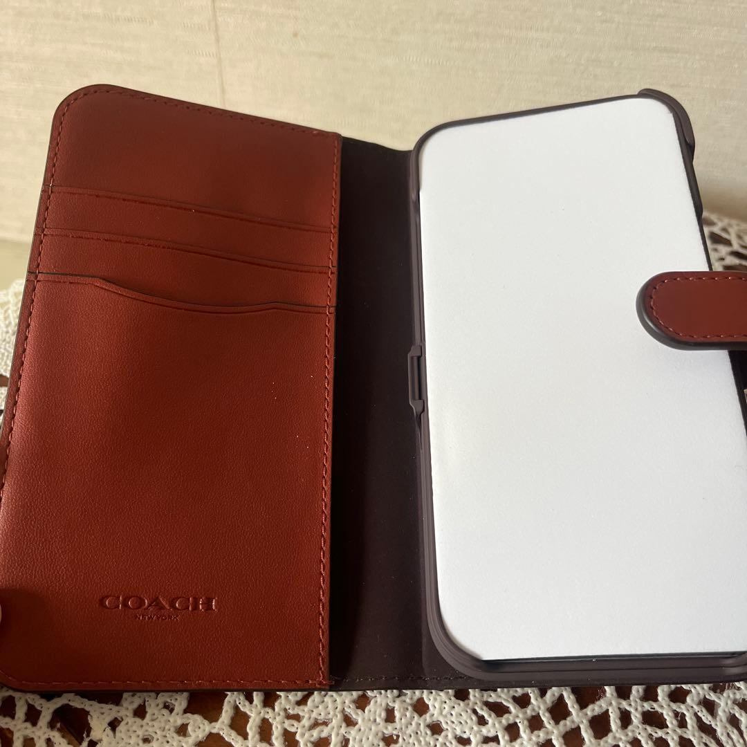専用新品コーチアイホン13手帳型ケース