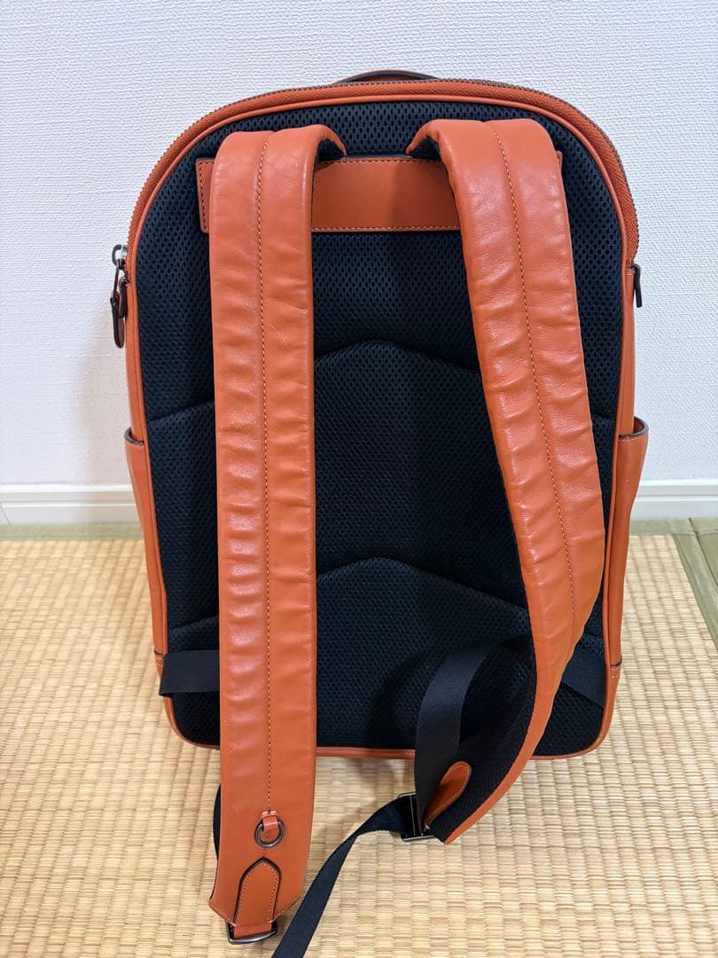 COACH オレンジレザーリュック