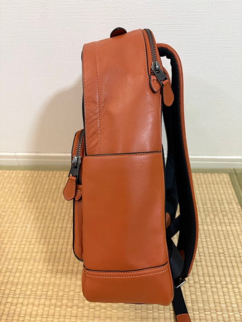 COACH オレンジレザーリュック