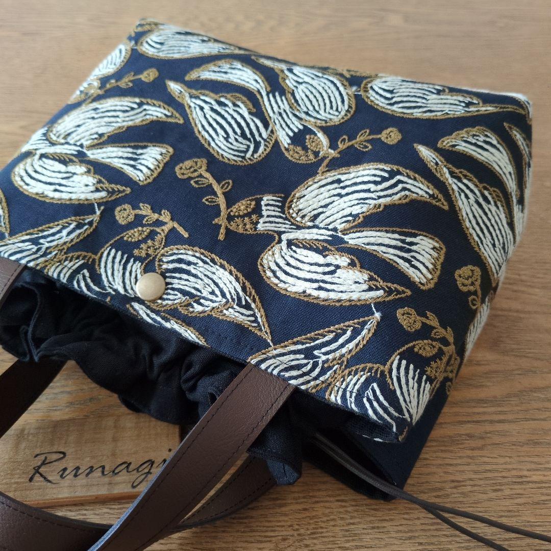 あおりポケットの巾着バッグ＊ミナペルホネン following day