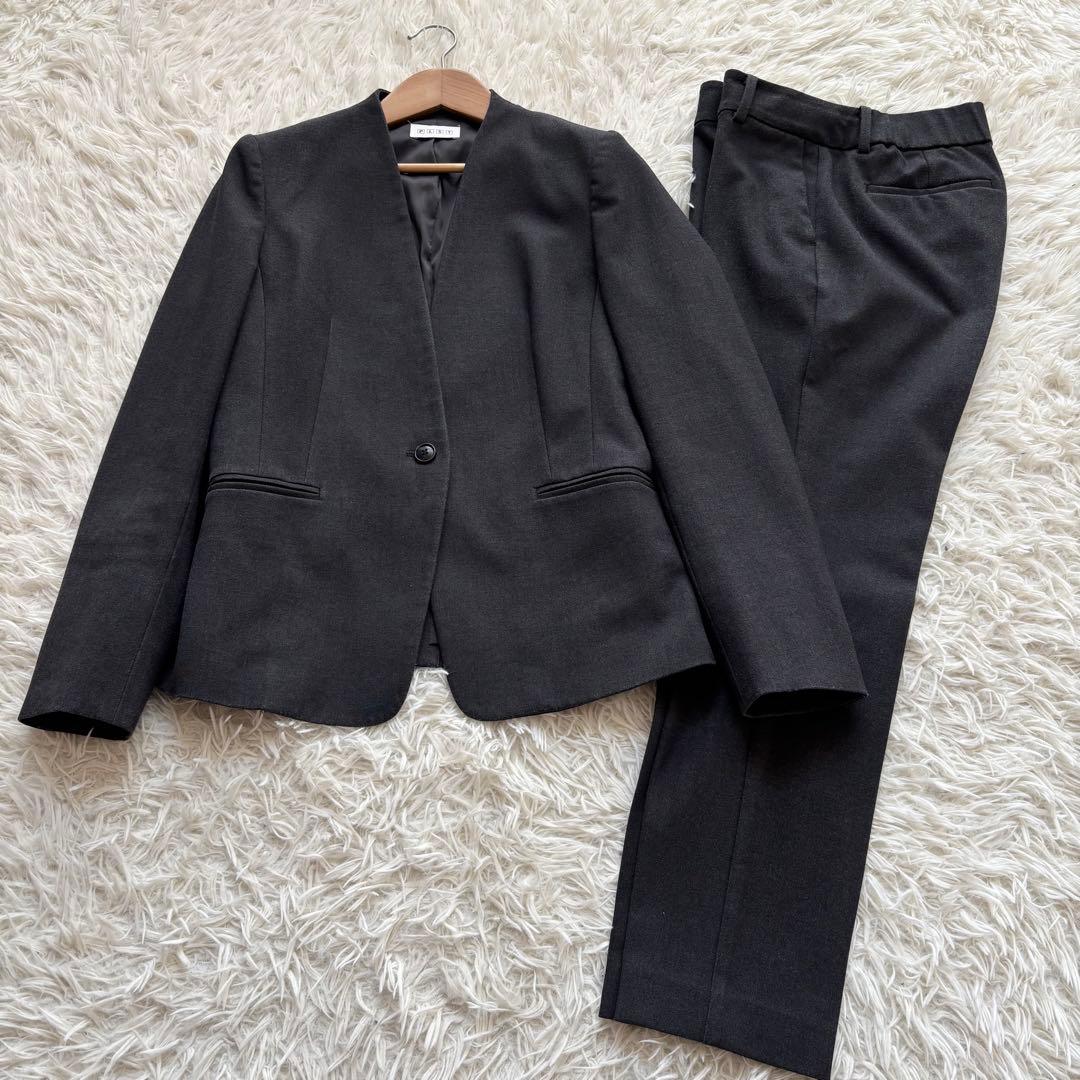 プラステ ウォームリザーブ カラーレス パンツスーツ セットアップM チャコール
