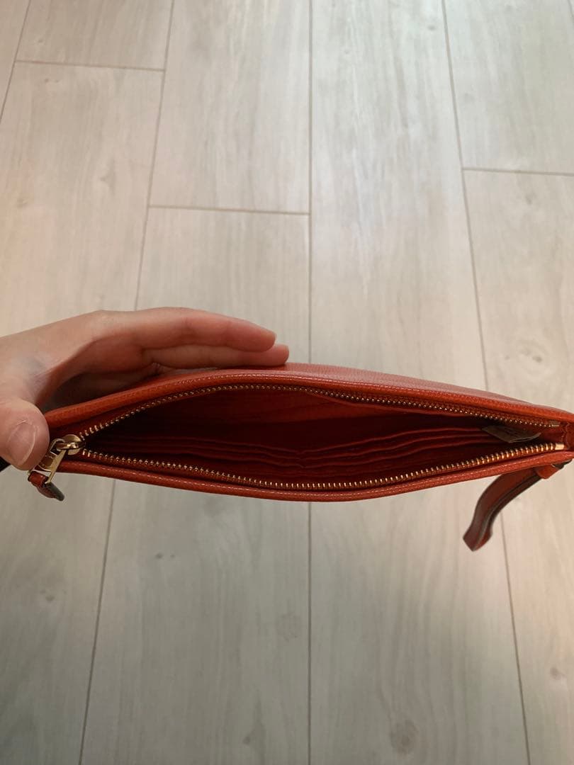 3,000円引！【ほぼ新品】COACHのリストレット/ポーチ（朱色/赤）レザー
