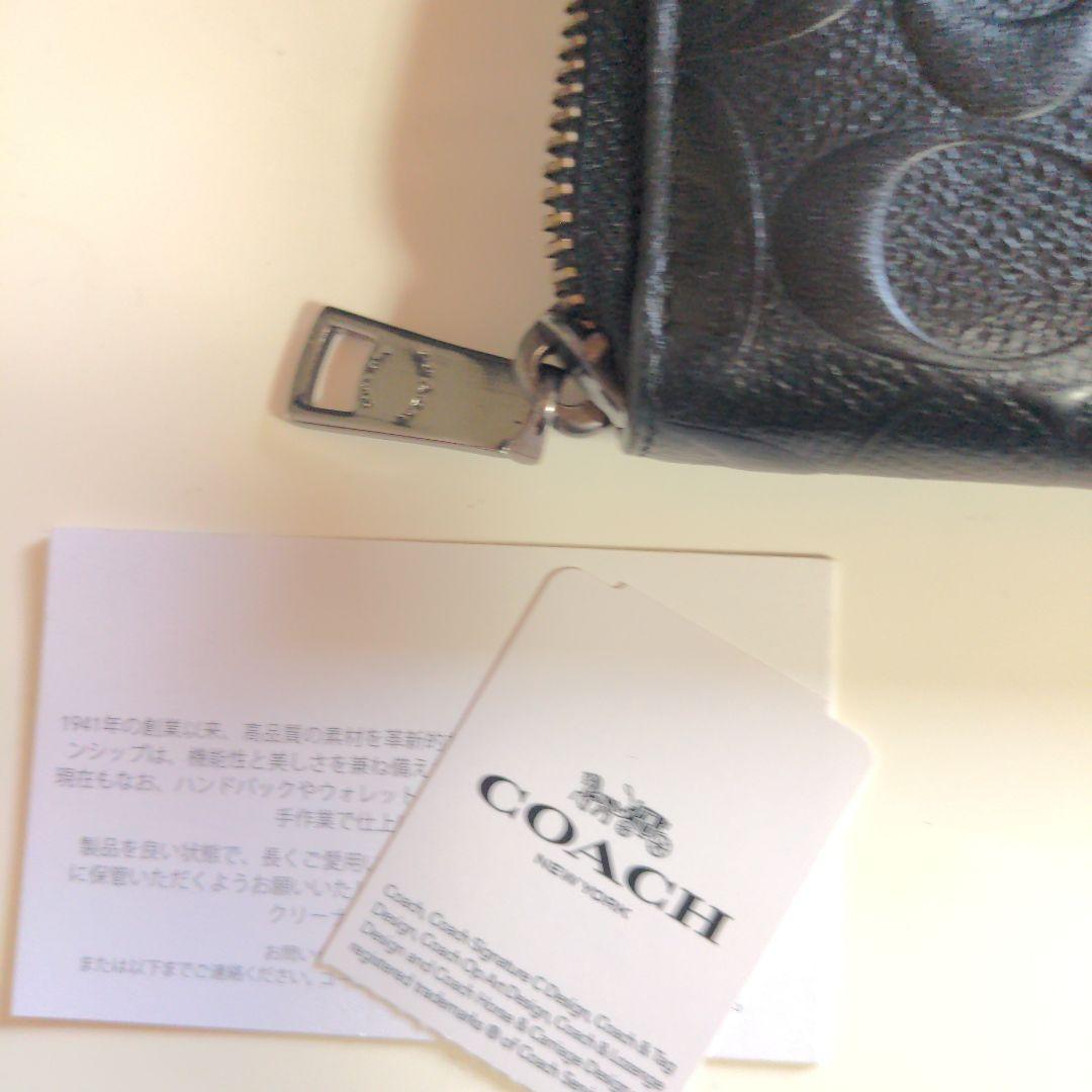 コーチ　COACHブラックpvcレザー エンボス加工 長財布