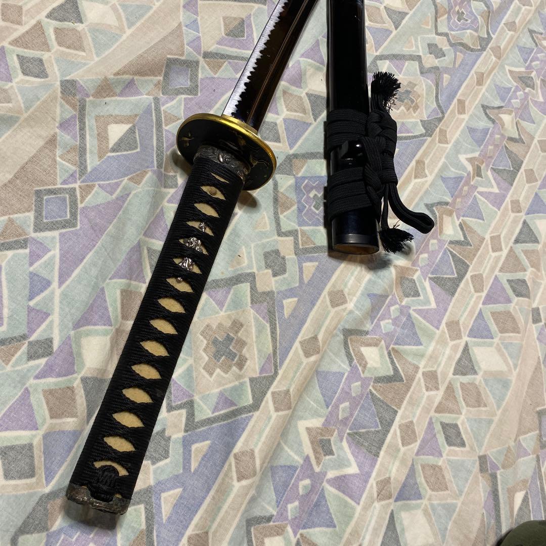 上級居合刀 黒柄 鶴波図楕円鍔 黒呂鞘