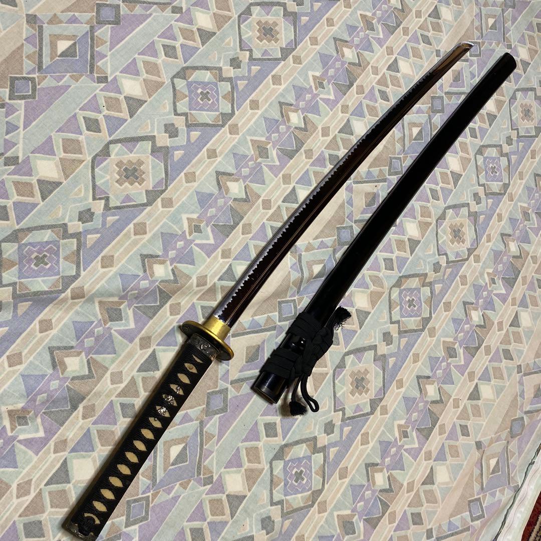 上級居合刀 黒柄 鶴波図楕円鍔 黒呂鞘