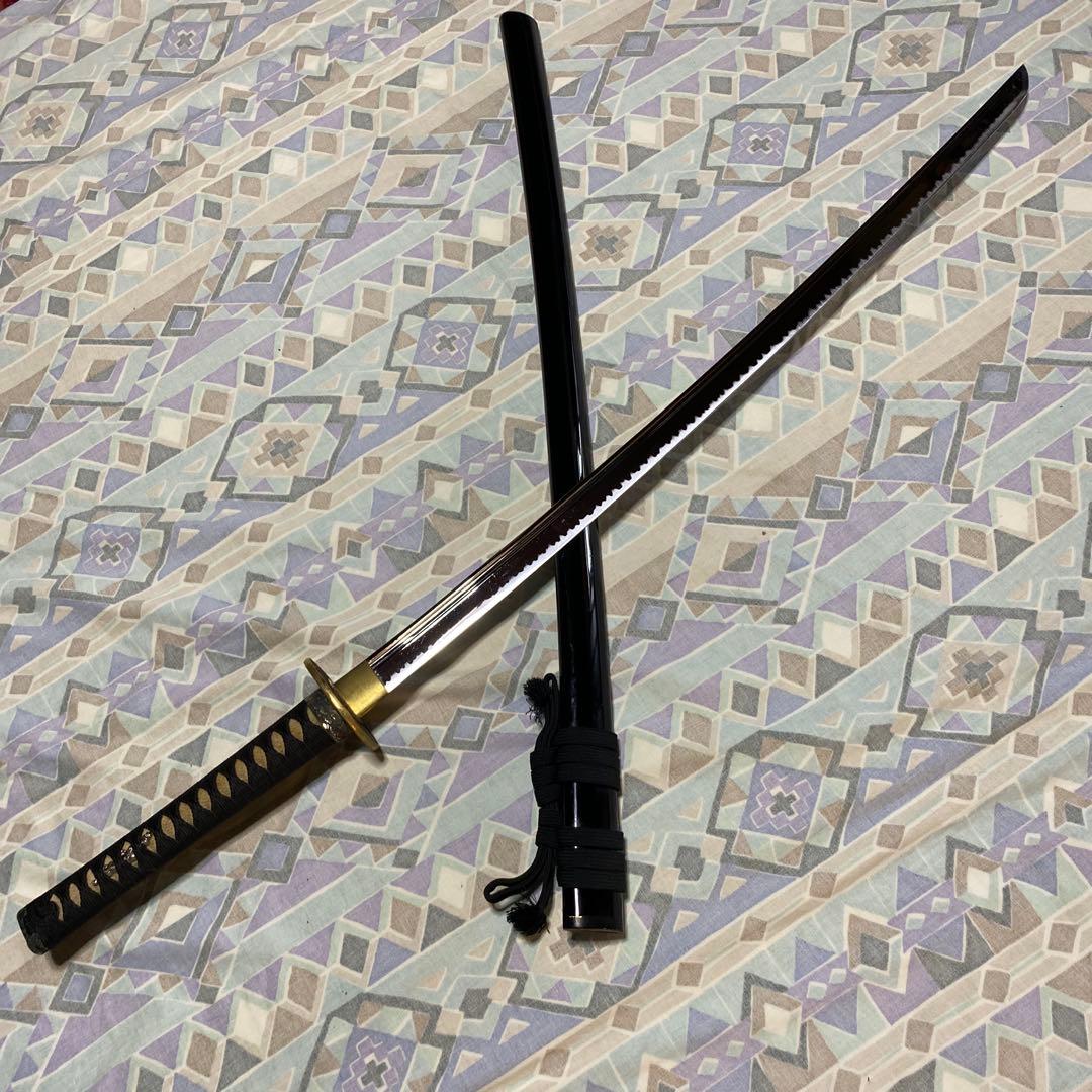 上級居合刀 黒柄 鶴波図楕円鍔 黒呂鞘