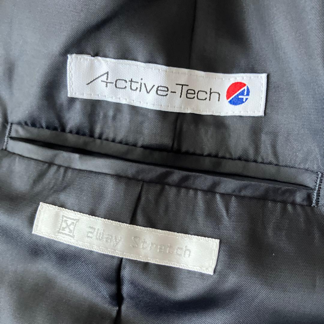 新品【アオキ　LES MUES】ネイビー ノーカラー パンツスーツ　レディース