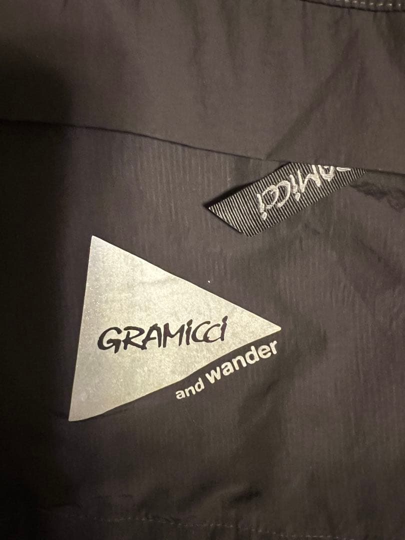 Gramicci x AND WANDERパッチワークウィンドパーカー Sサイズ