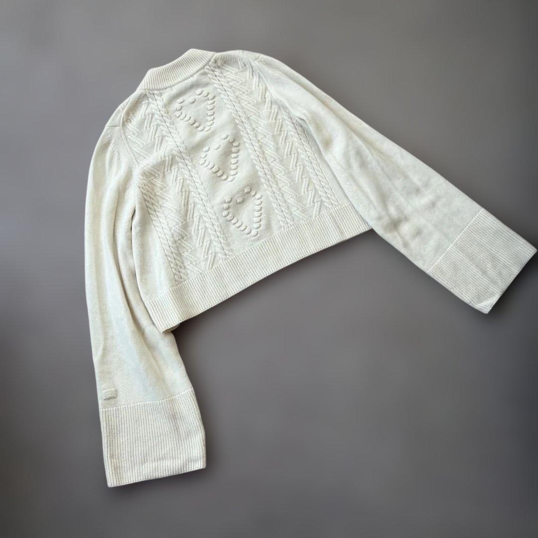 manufactured by WRAPINKNOT ニットトップス