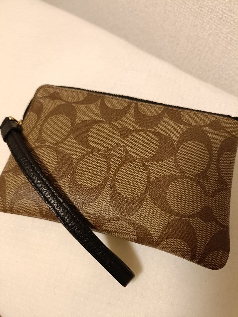 カ*ヌ様 COACH 恐竜イラスト付きポーチ