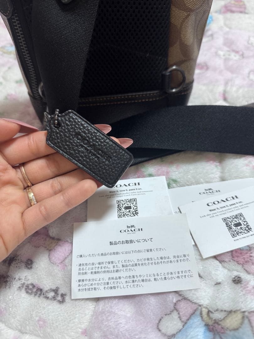 COACH ロゴ入りバックパック