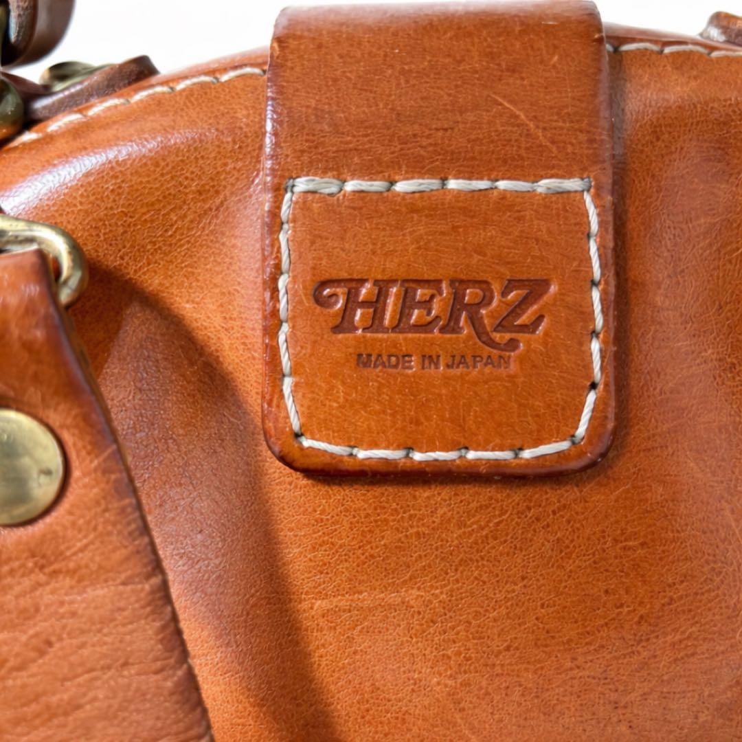 ヘルツ わんぱくリュック がま口 レザー バックパック ロック金具 鍵付き 茶