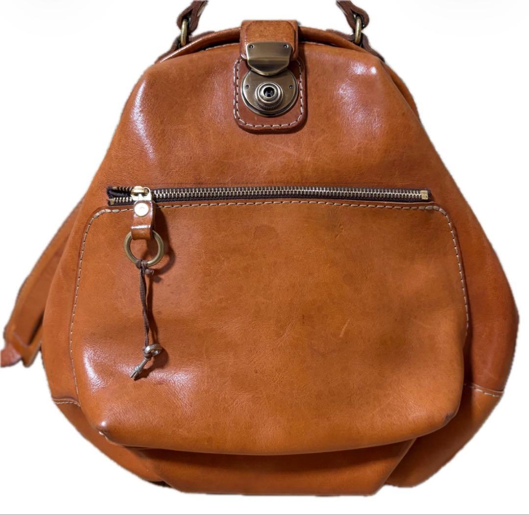 ヘルツ わんぱくリュック がま口 レザー バックパック ロック金具 鍵付き 茶