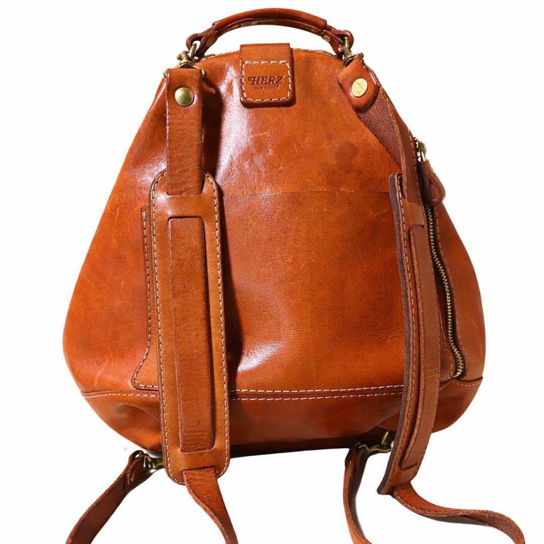 ヘルツ わんぱくリュック がま口 レザー バックパック ロック金具 鍵付き 茶
