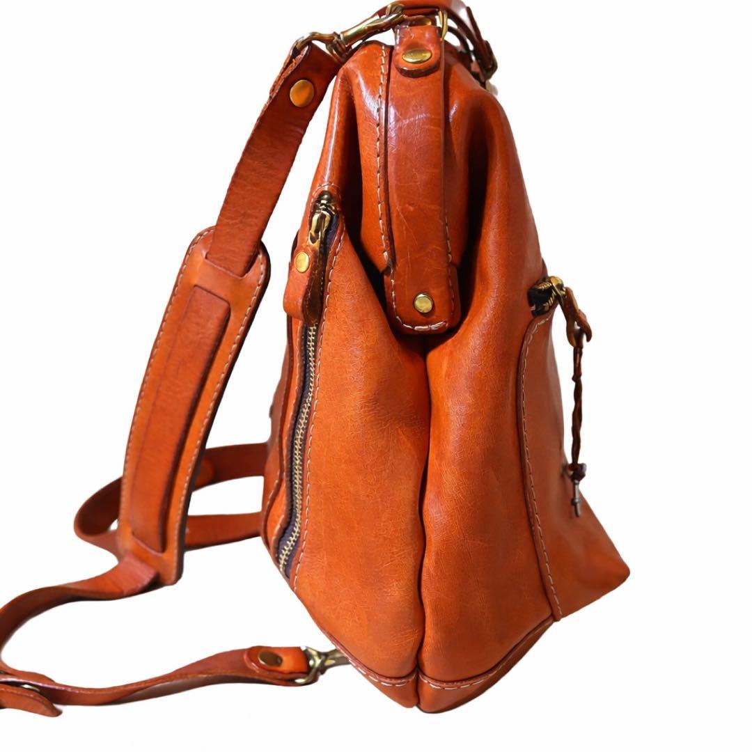 ヘルツ わんぱくリュック がま口 レザー バックパック ロック金具 鍵付き 茶