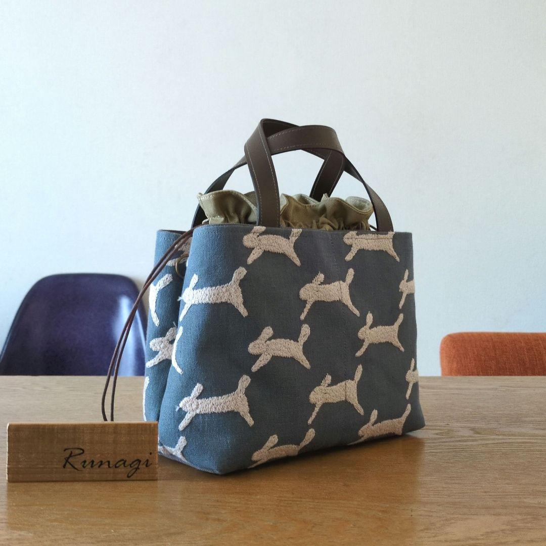 【1569】あおりポケットの巾着バッグ＊ミナペルホネン