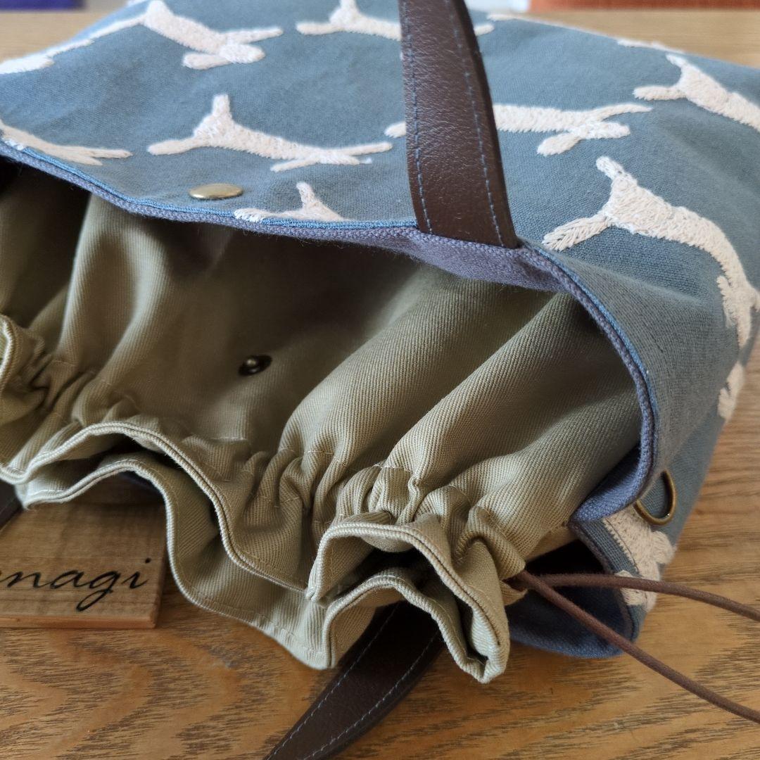 【1569】あおりポケットの巾着バッグ＊ミナペルホネン