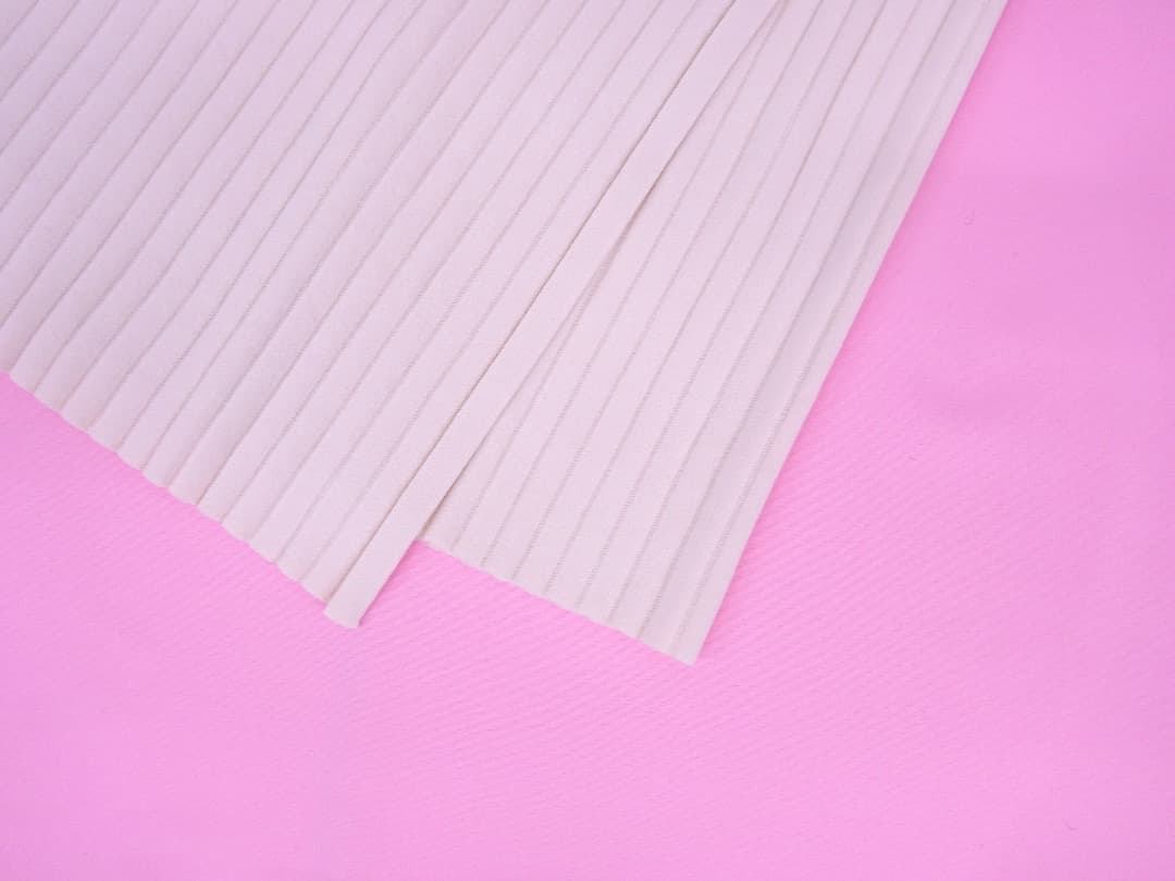 リビアナコンティリブ編みニットロングスカートウエストチラ見え　アシンメトリー