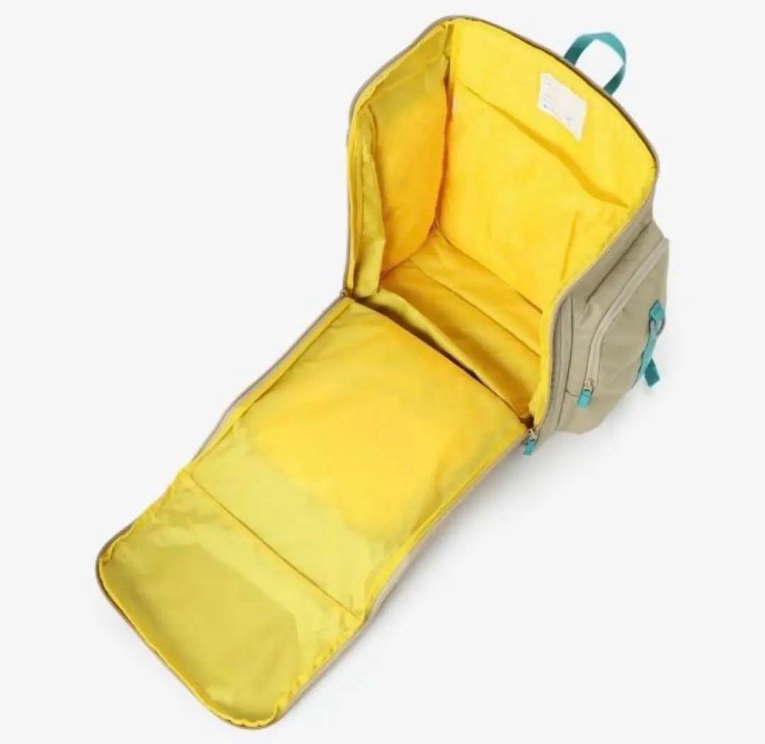 Colombia ベージュリュック ターコイズストラップ付き