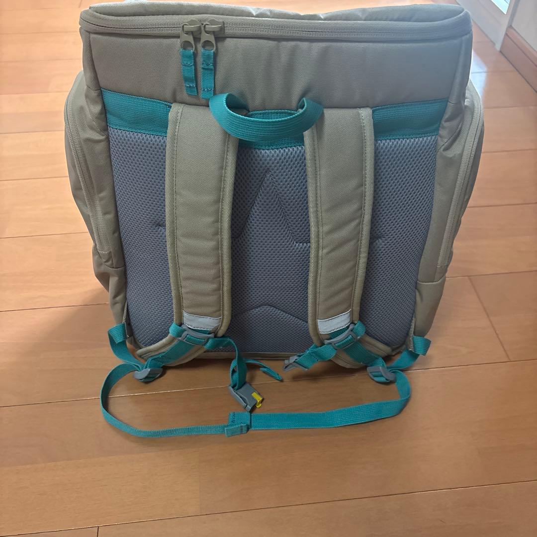 Colombia ベージュリュック ターコイズストラップ付き