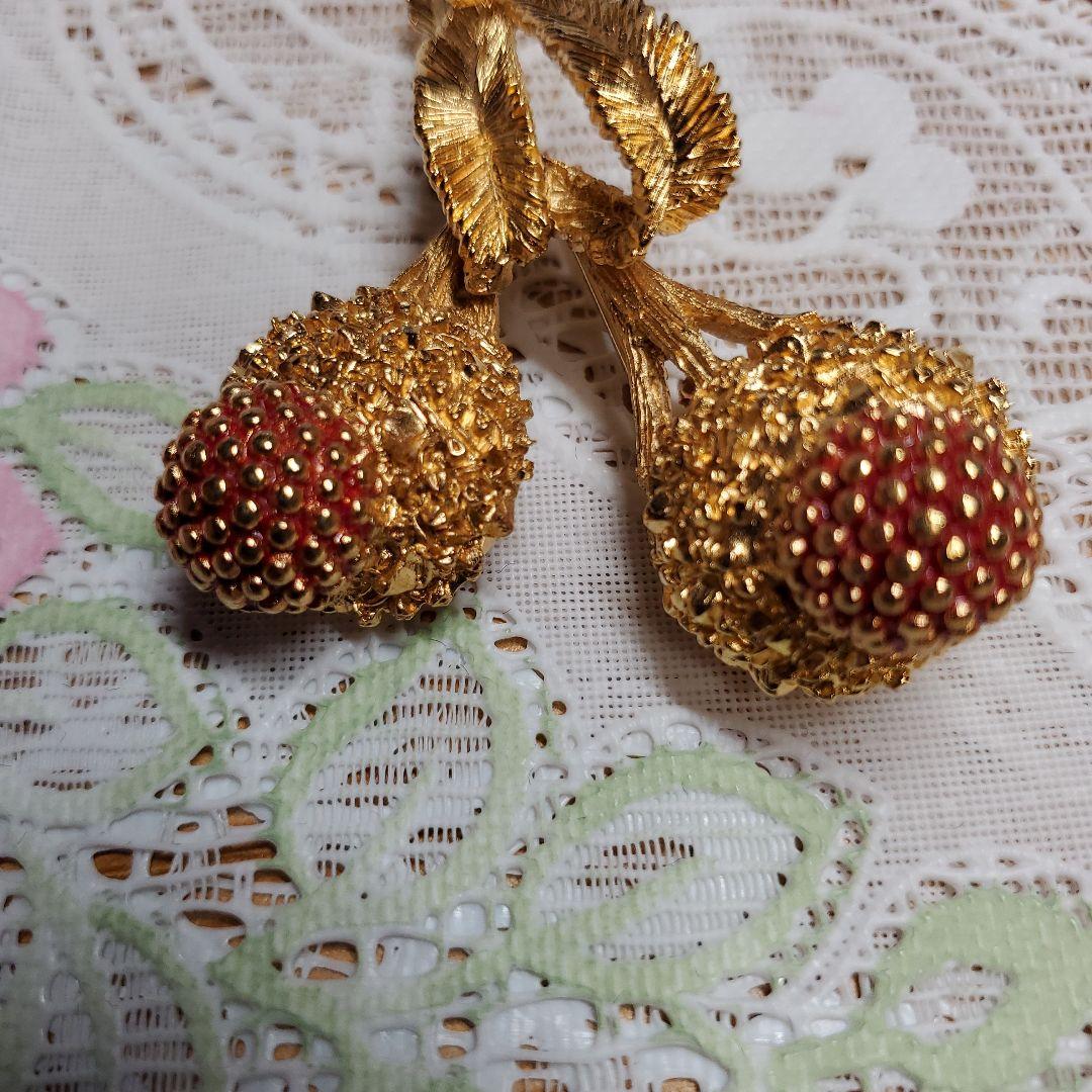 Carven 金色の花束ブローチ