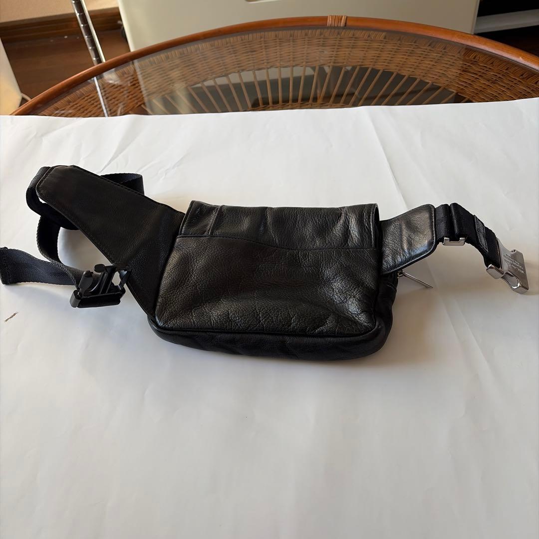 u*l様 TUMI/・トゥミイ黒 レザー ボディバッグ ウエストポーチフラップ付