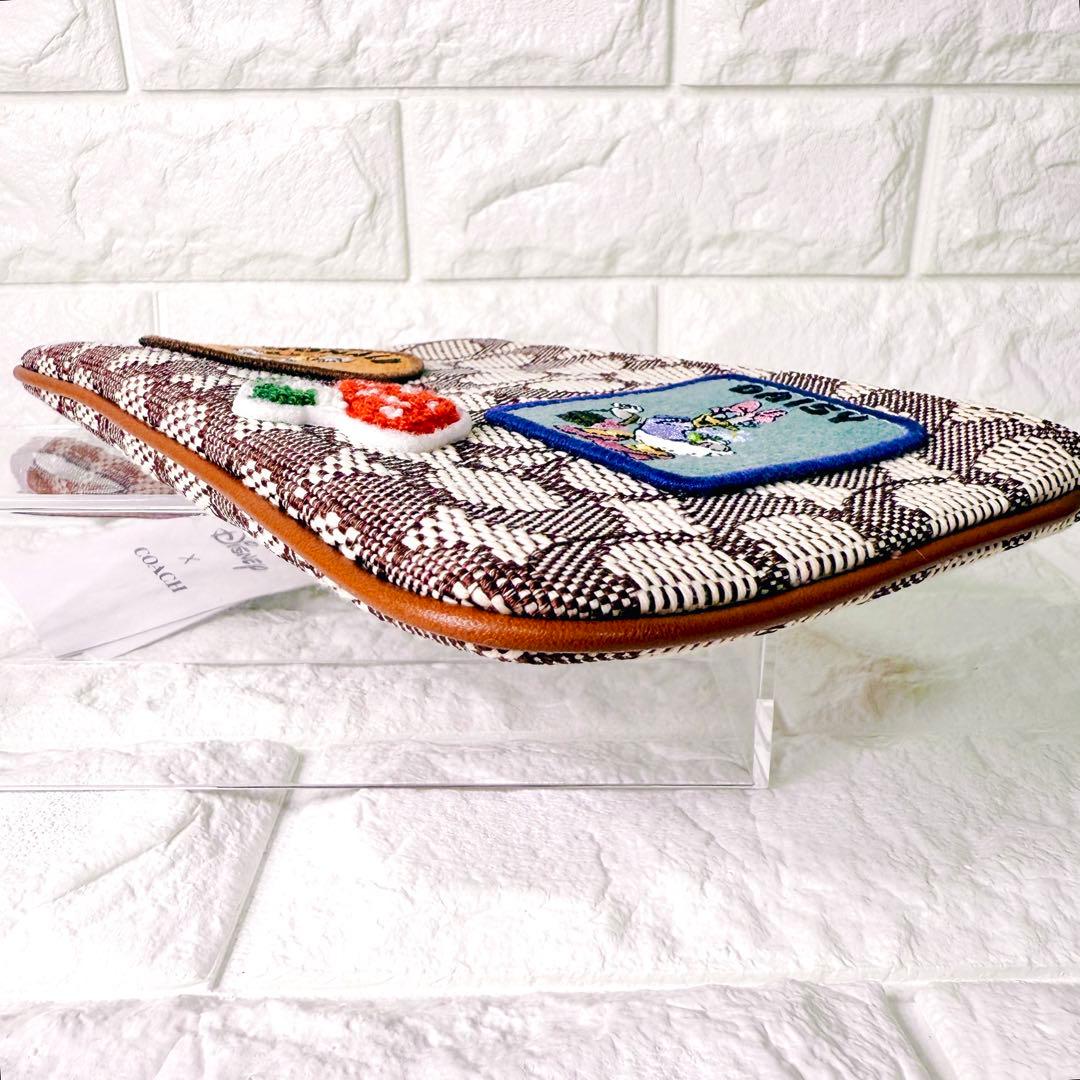 タグ付【未使用】COACH ポーチ シグネチャー ディズニー ドナルド デイジー