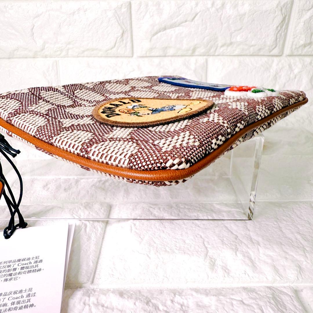 タグ付【未使用】COACH ポーチ シグネチャー ディズニー ドナルド デイジー