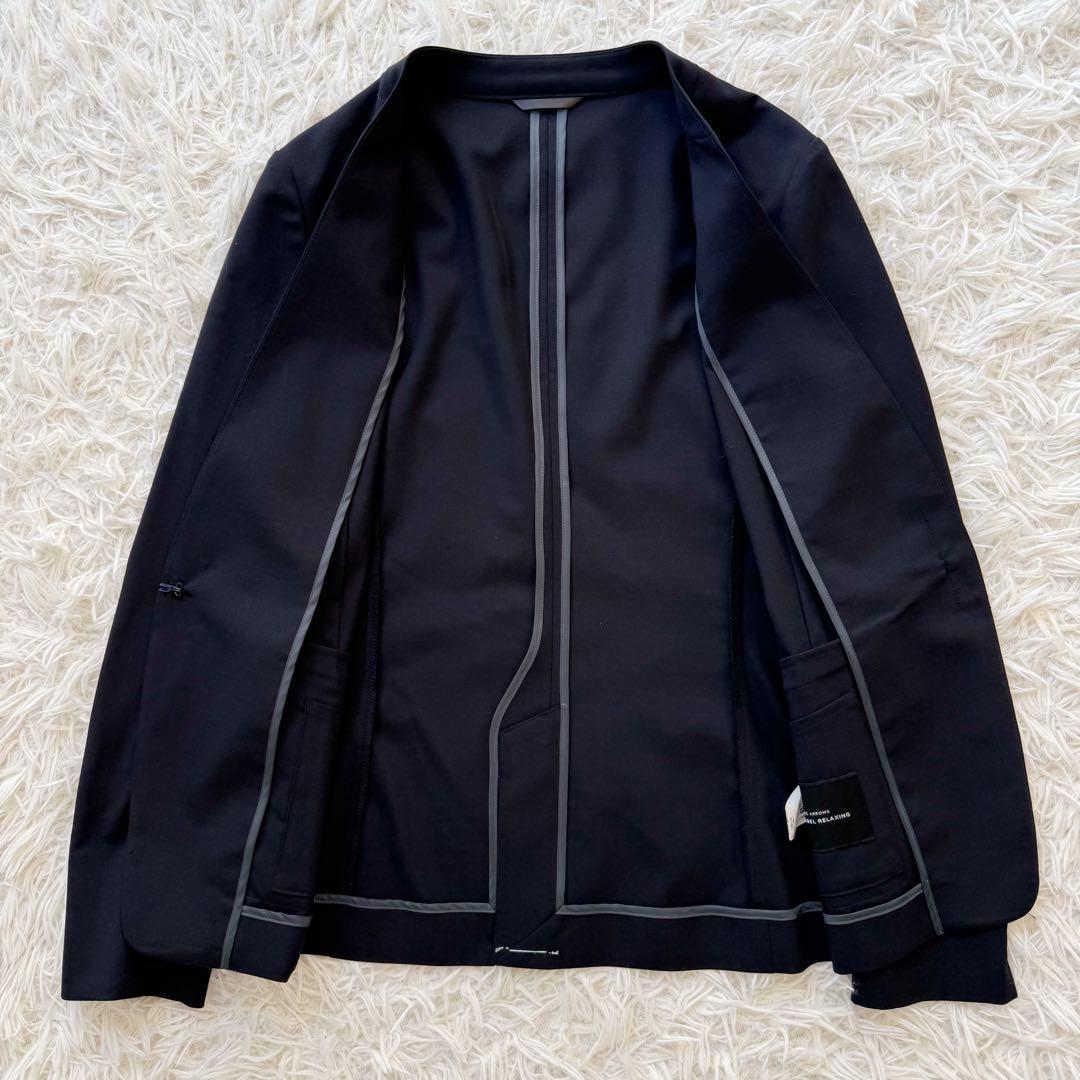 グリーンレーベルリラクシング セットアップスーツ ノーカラー 手洗可 ネイビー