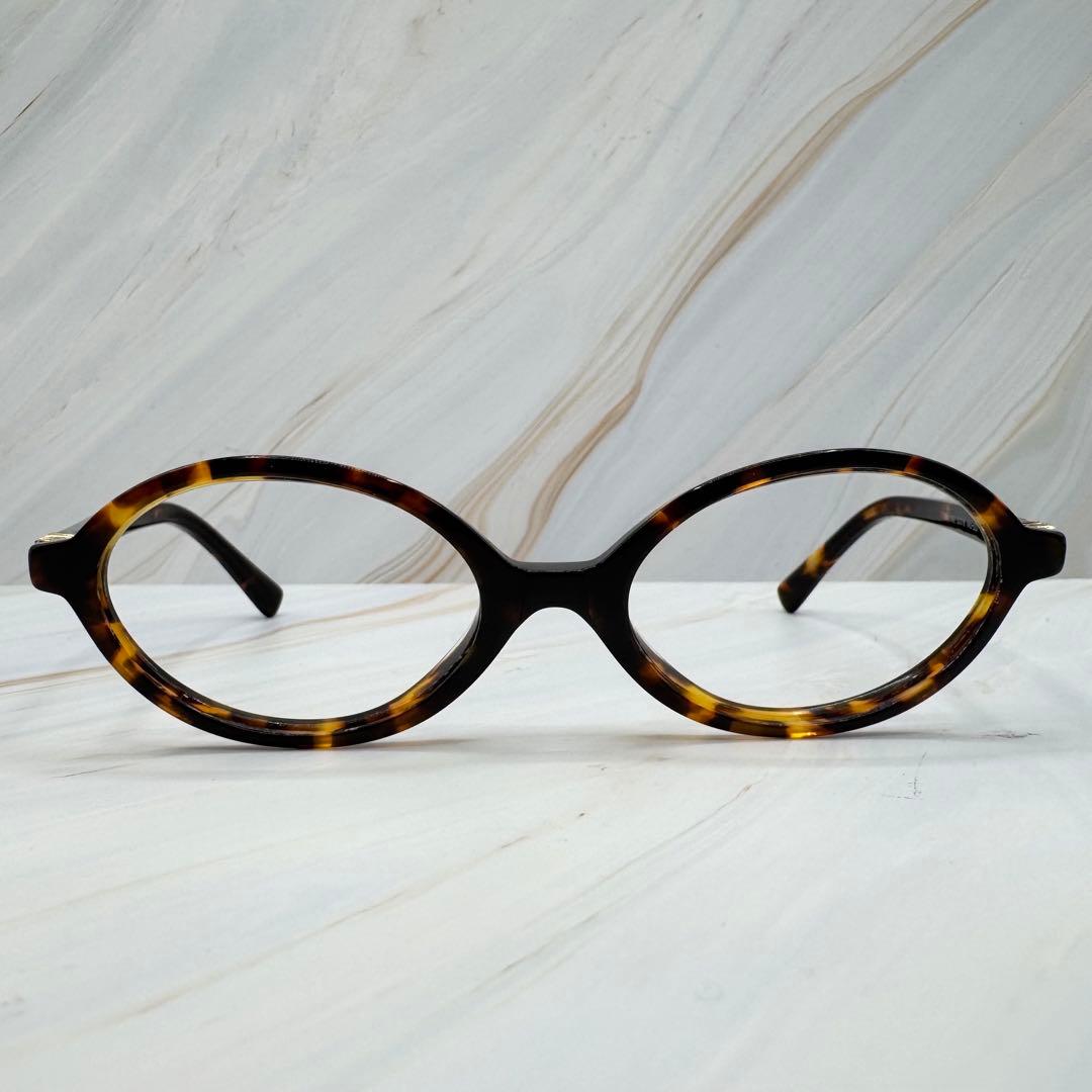 【ミュウミュウ】ウォニョン着用　 レンズなし　伊達メガネ べっこう柄　ロゴ