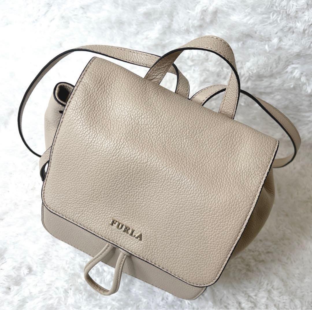 未使用級✨フルラ ミニリュック レザー ロゴ 巾着型 袋付き ベージュ