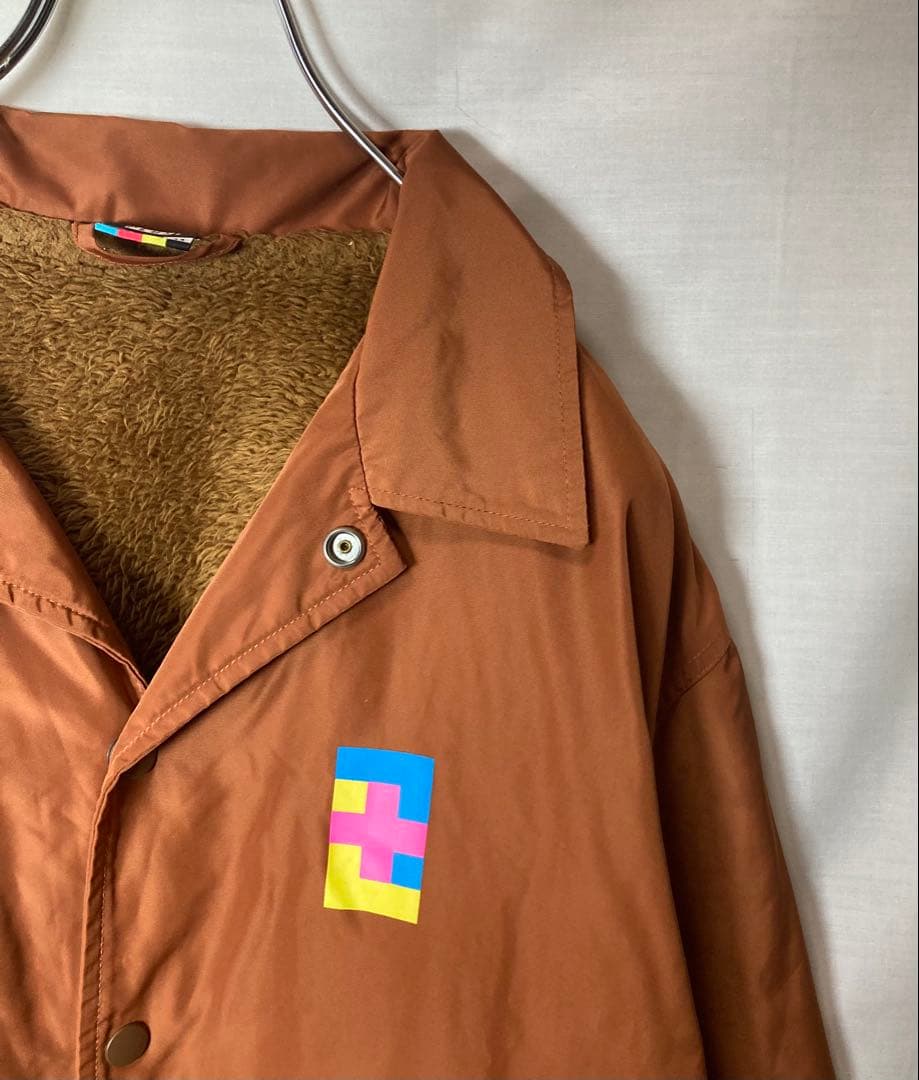 XLARGEギャルヒップビッグプリントくすみオレンジ裏ボアコーチジャケットL