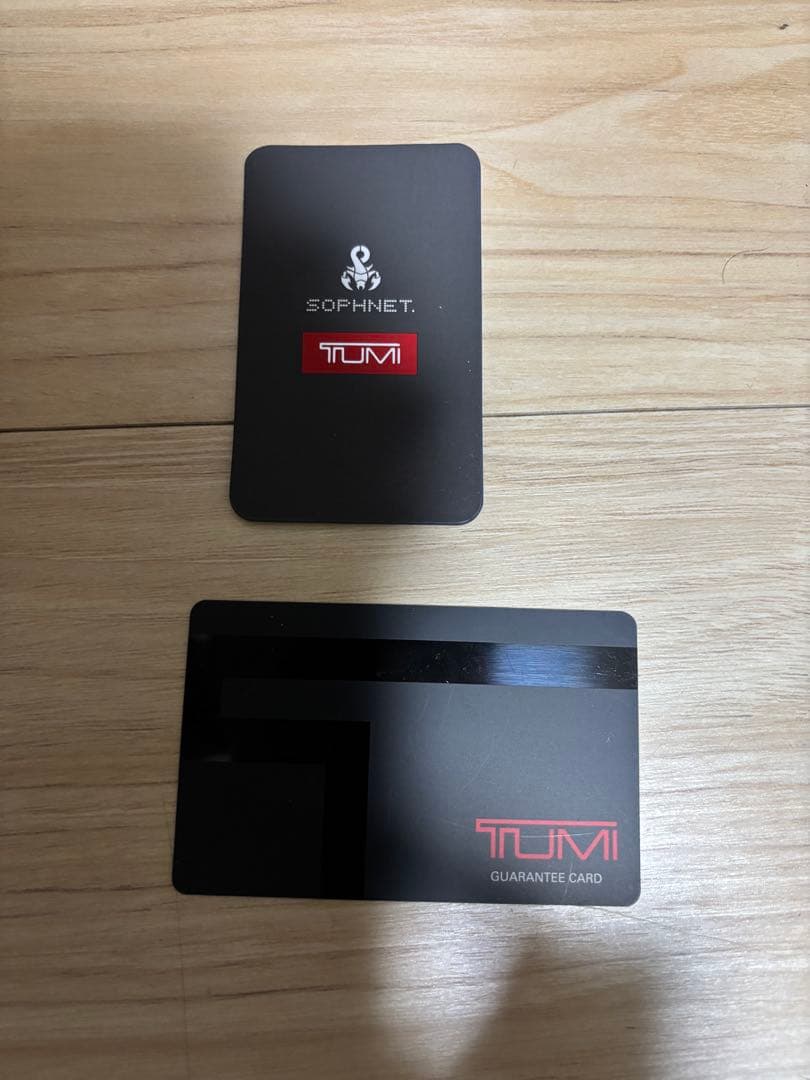 (おし)TUMI SOPHNET. ネイビー 長財布