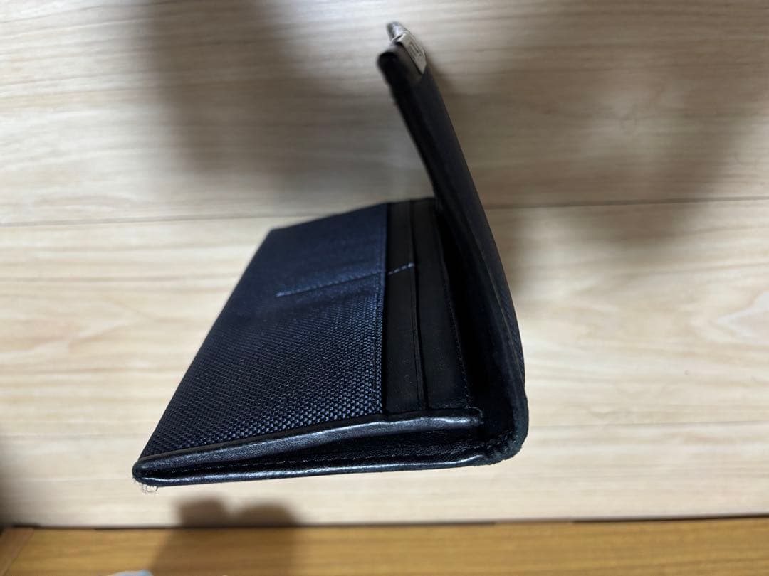 (おし)TUMI SOPHNET. ネイビー 長財布