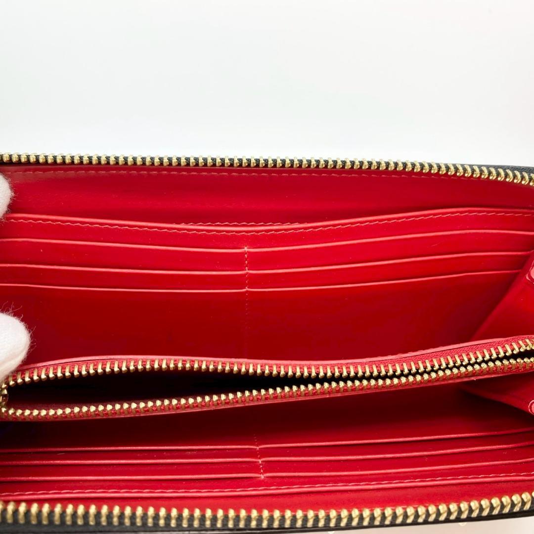 【CHRISTIAN LOUBOUTIN】 ラウンドジッピー　長財布　スタッズ