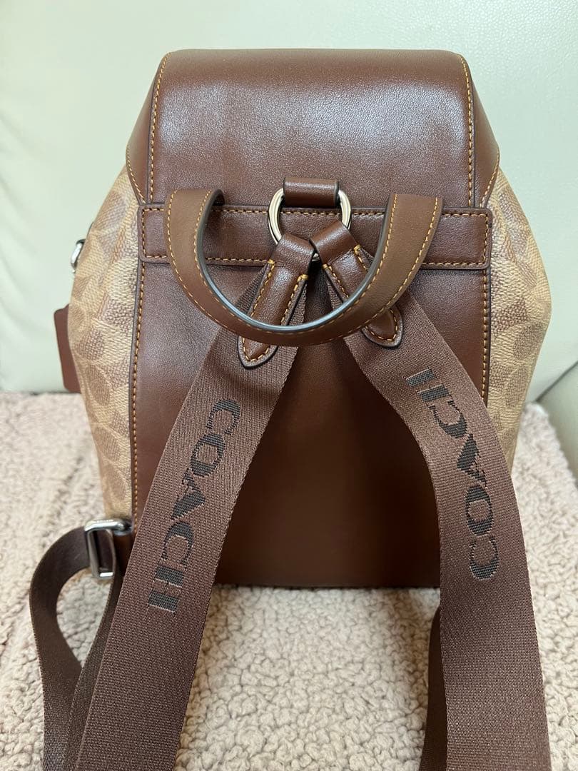 COACH ロゴ入りブラウンレザーバックパック