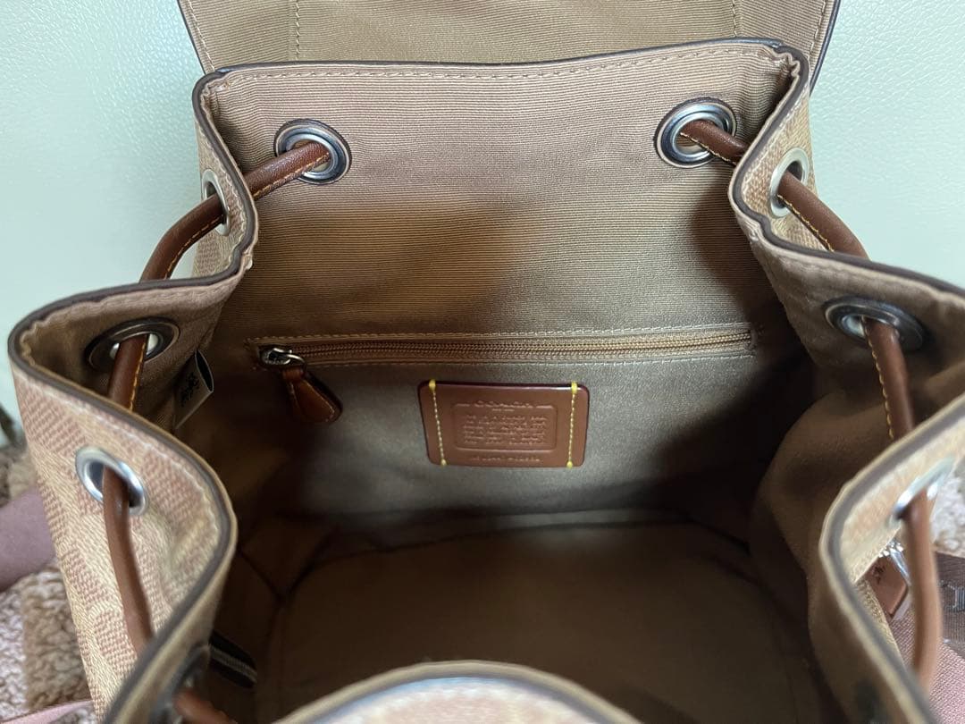 COACH ロゴ入りブラウンレザーバックパック