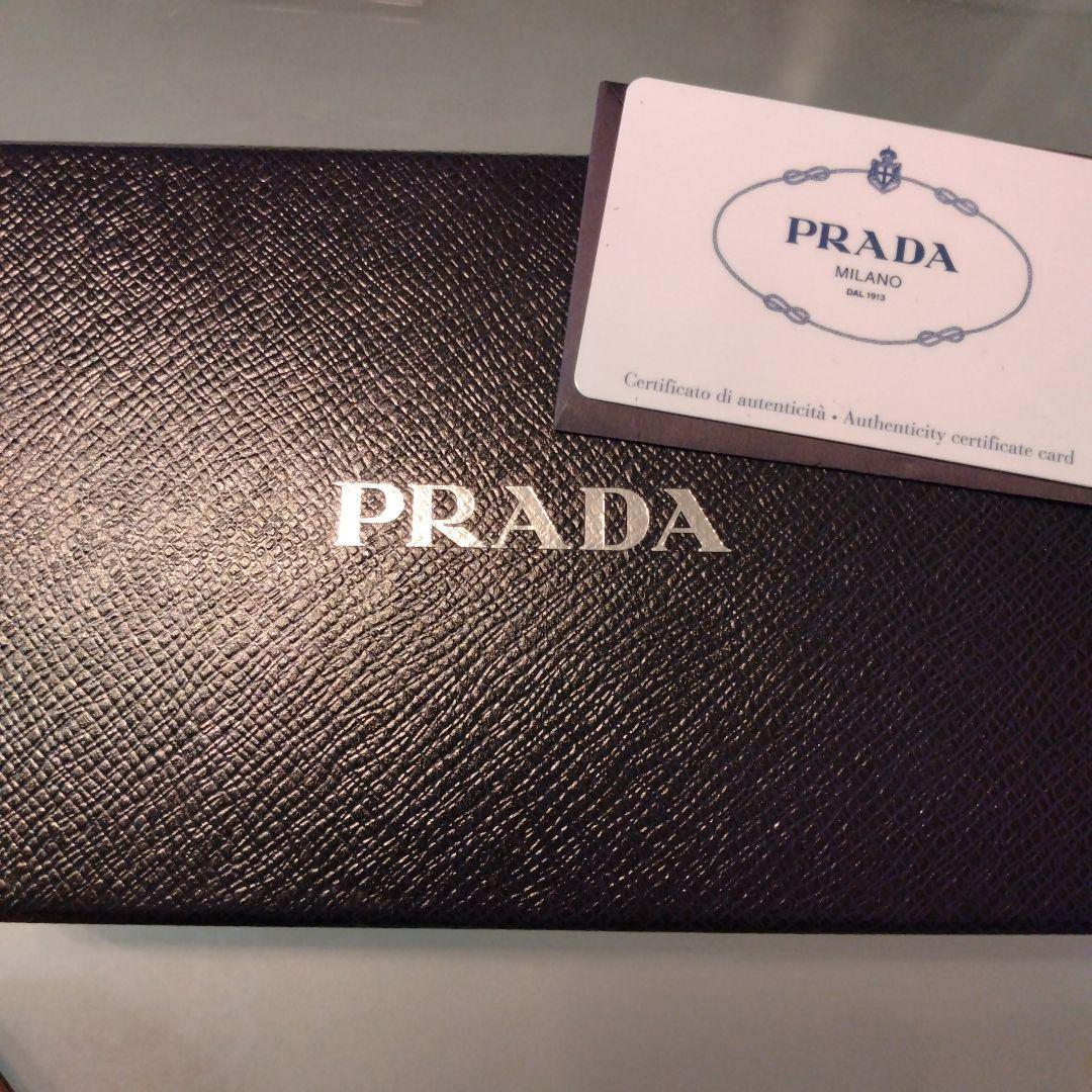 PRADA 二つ折り財布 リボン　ピンクベージュ