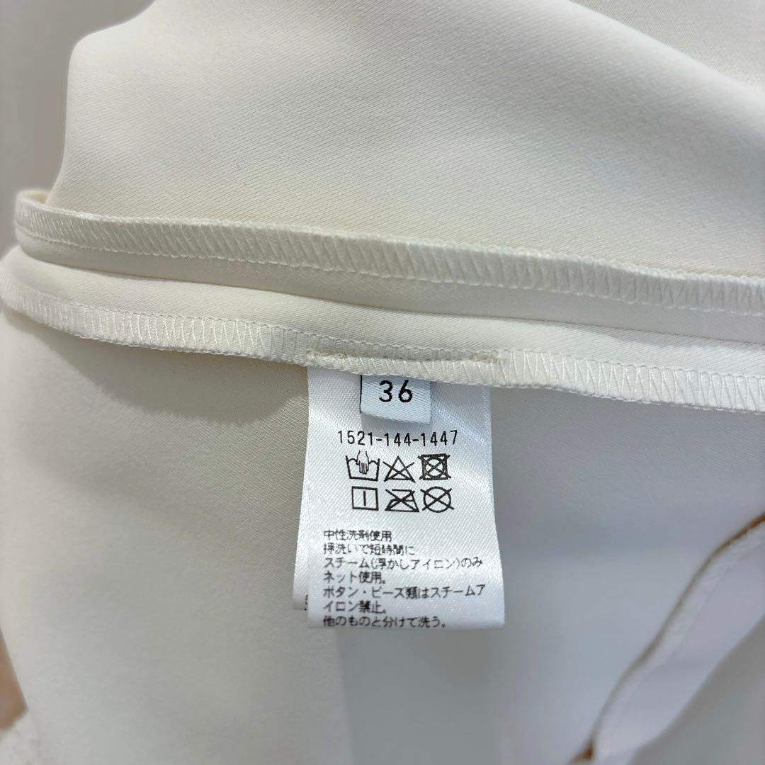 ユナイテッドアローズ　SPONGY パールモチーフ ペプラム ブラウス　ホワイト