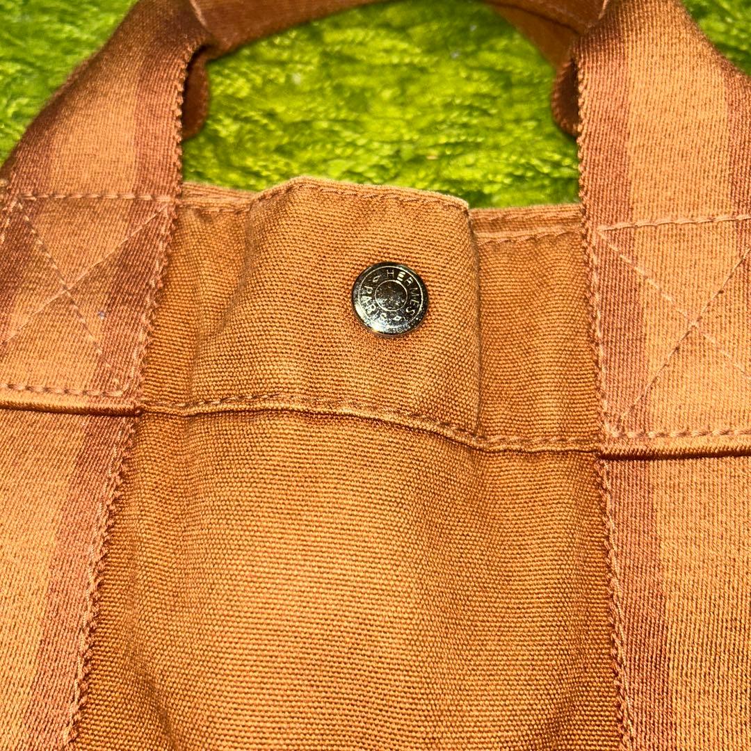 エルメスのブラウンレザーストライプトートバッグ